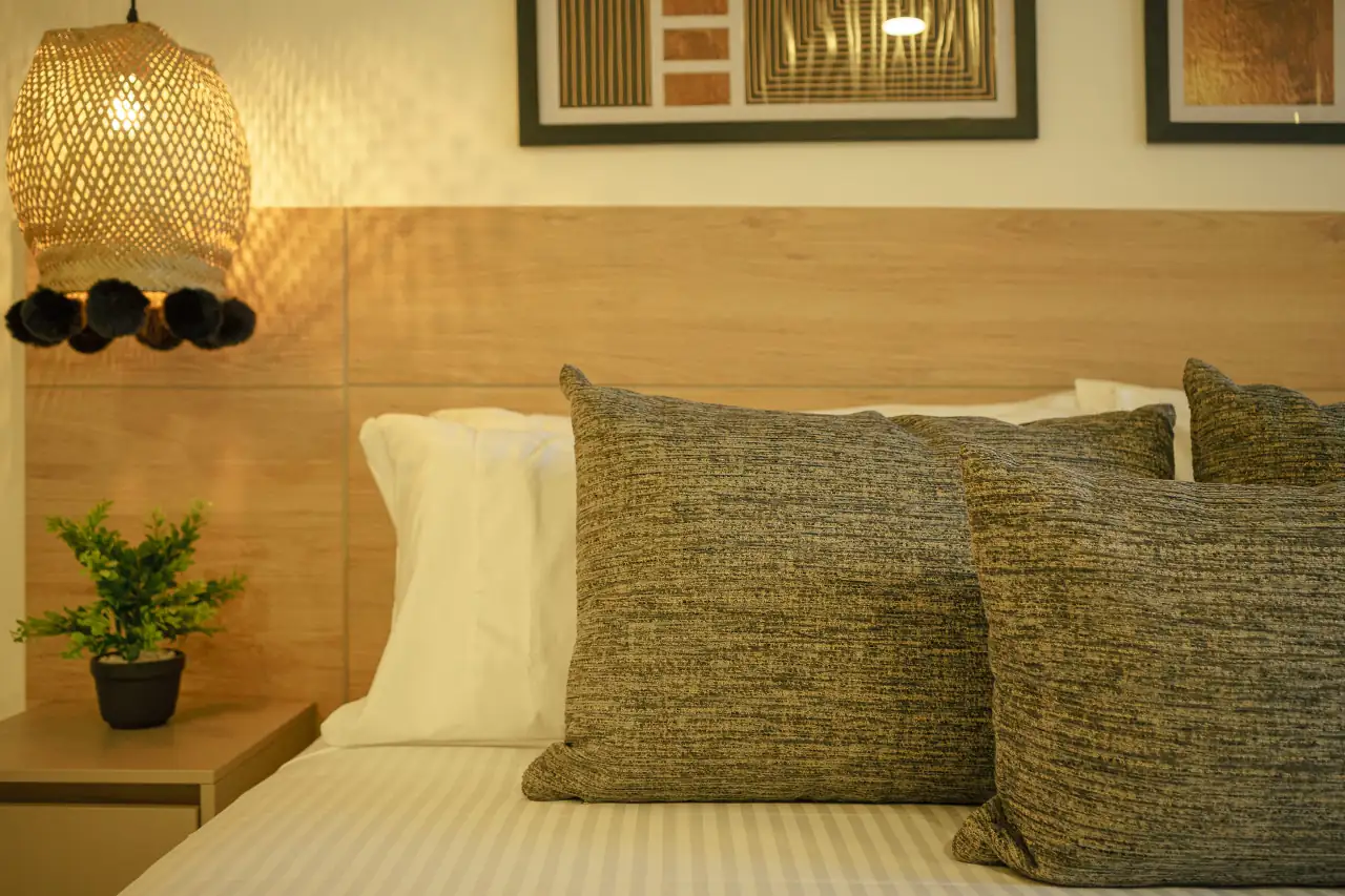 deluxe-room-first-class-hotel-medelin-bed-view-1.webp