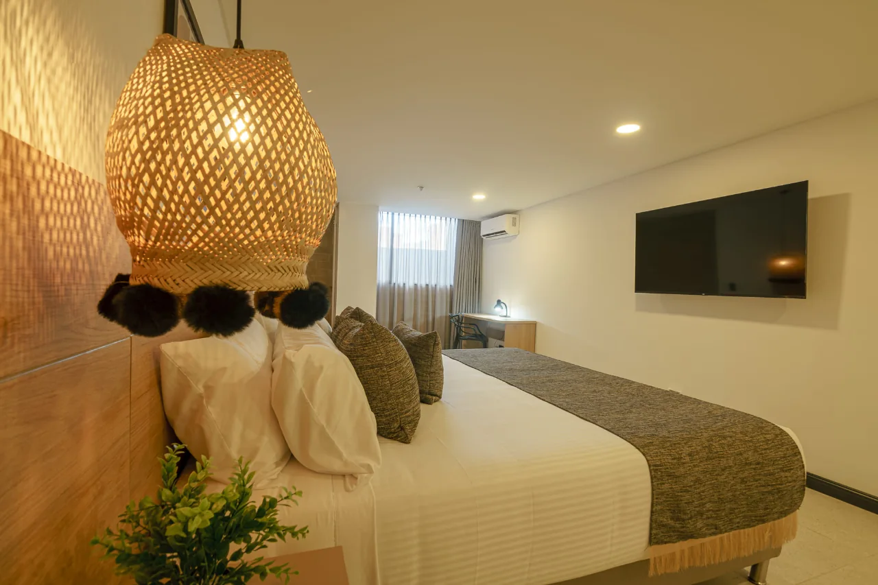 deluxe-room-first-class-hotel-medelin-bed-view-3.webp